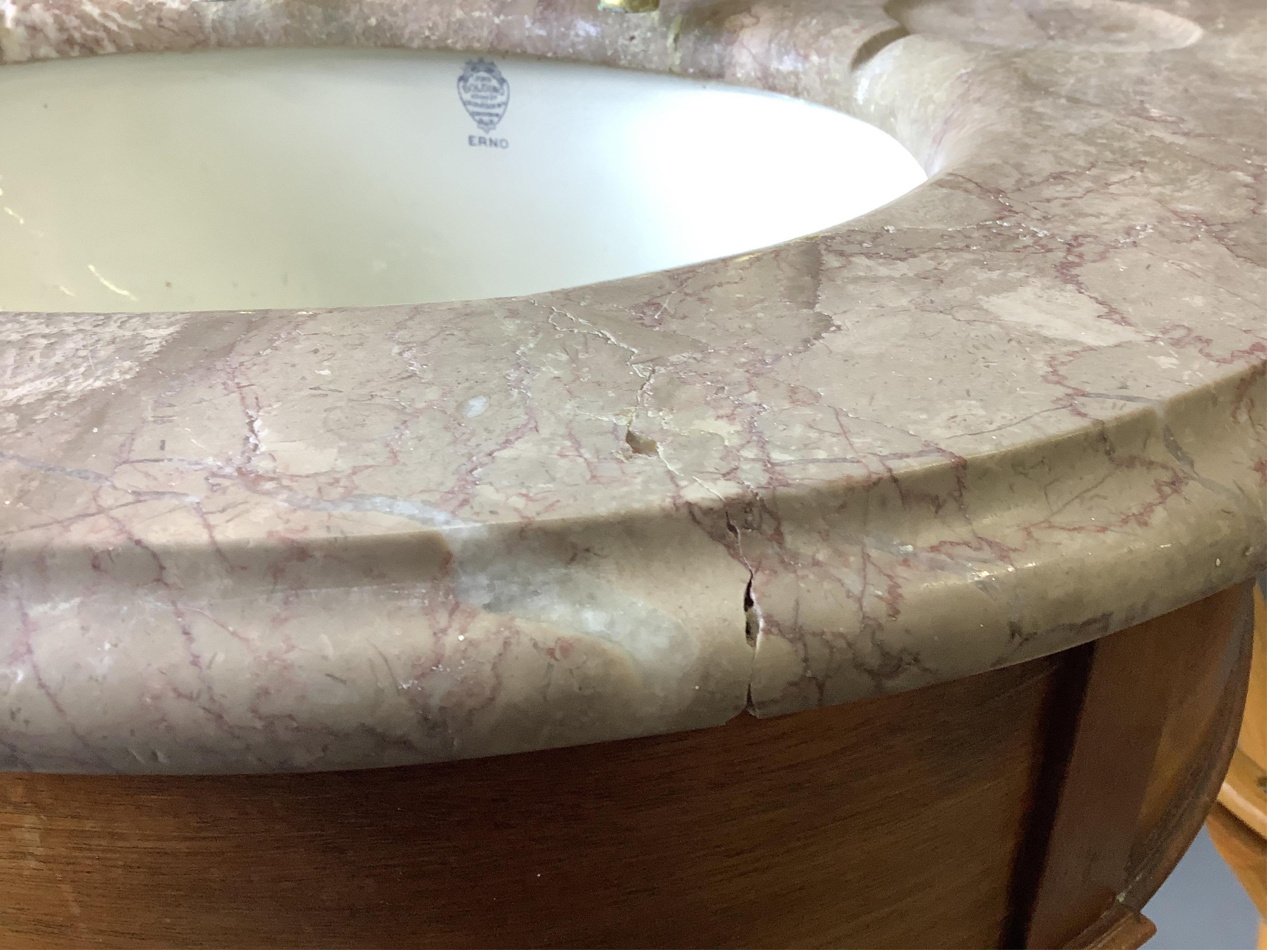 A marbled topped mahogany wash basin with John Bolding & Sons Erno ceramic basin and brass metal work, width 69cm, height 117cm. Condition - two old repair cracks to the marble top near front right, otherwise fair